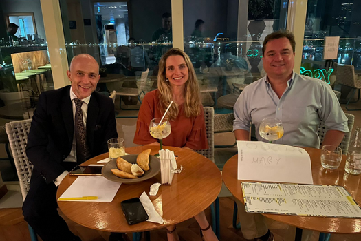 Professor Ioannis Kokkoris, Gustavo Braga, Maria Magalhães at a bar